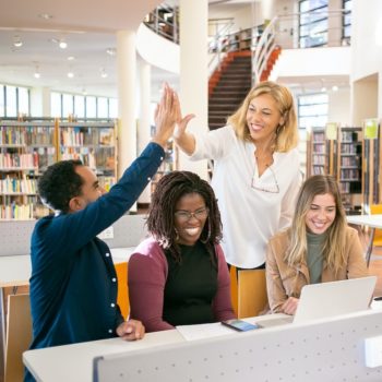 A group of people in a library celebrating